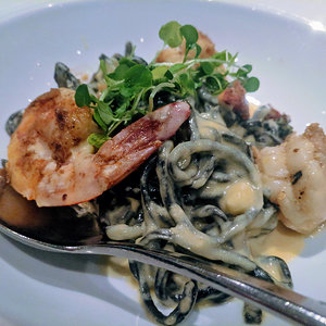 Shrimp on squid ink pasta