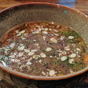Beef bone broth with veggies and organic sprouted seeds
